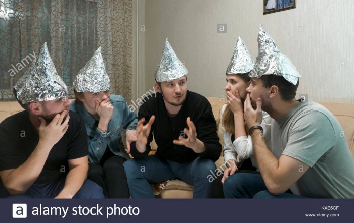 group-of-people-with-foil-on-their-heads-discussing-conspiracy-theories-KXE6CF.jpg